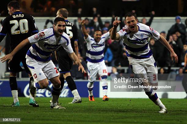 Clint Hill of QPR celebrates scoring the second goal of the game with team mates after he heads in a Adel Taarabt corner during the npower...