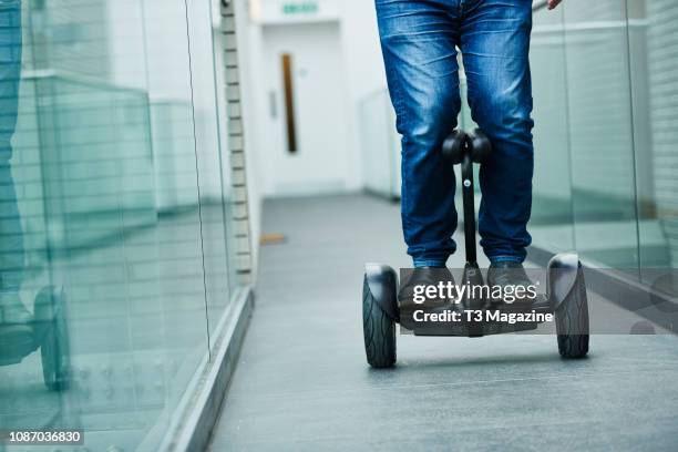 Detail of a man riding a Ninebot by Segway miniPRO, taken on March 6, 2017.