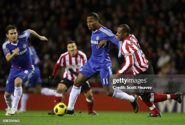 Didier Drogba of Chelsea is closed down by Titus Bramble of Sunderland during the Barclays Premier League match between Sunderland and Chelsea at the...