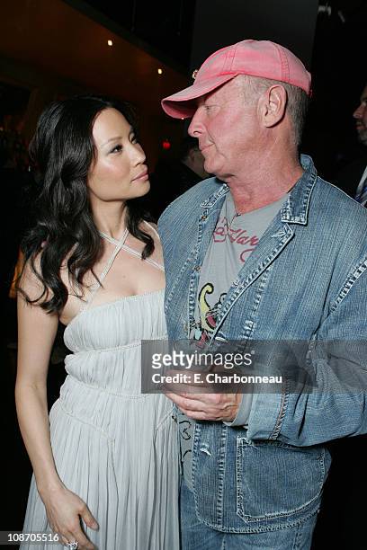 Lucy Liu and Tony Scott, director during New Line Cinema's "Domino" Los Angeles Premiere at Grauman's Chinese Theatre in Los Angeles, California,...