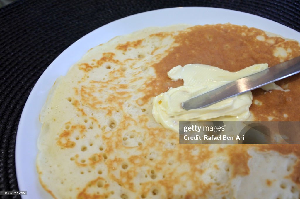 Knife Spreading Butter on Pancake