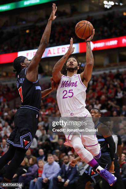 Derrick Rose of the Minnesota Timberwolves puts up a shot against Justin Holiday of the Chicago Bulls at the United Center on December 26, 2018 in...