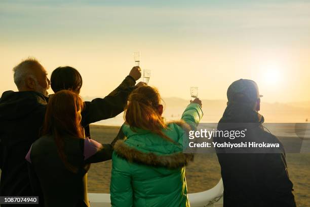 local senior surfer toast in the morning at shonan coast. - no face ストックフォトと画像