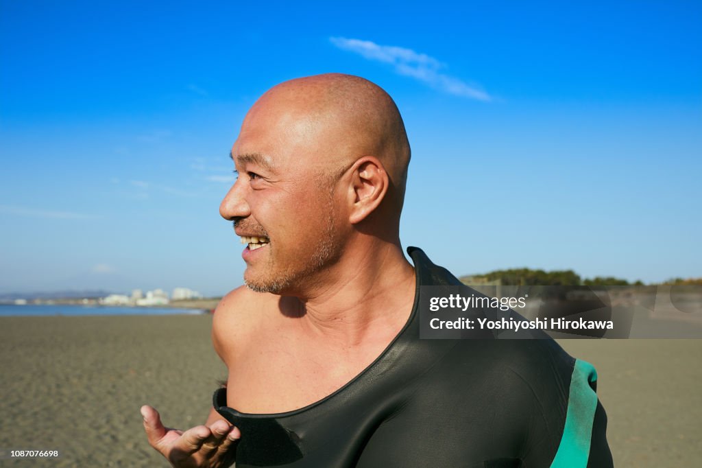 Portrait of company president in holiday on beach at morning.