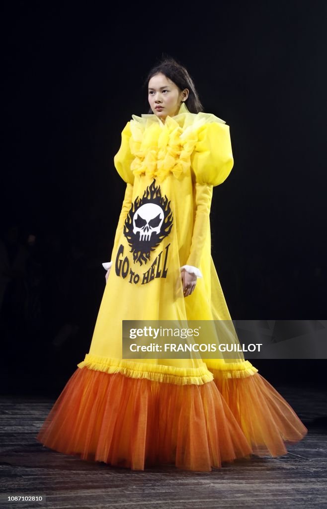A model presents a creation by Viktor and Rolf during the 2019... News ...