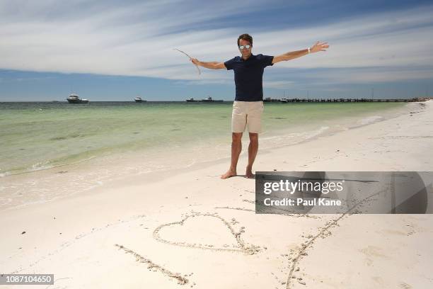 Roger Federer signs I Love WA on the beach ahead of the 2019 Hopman Cup at The Lobster Shack on December 27, 2018 in Cervantes, Australia.