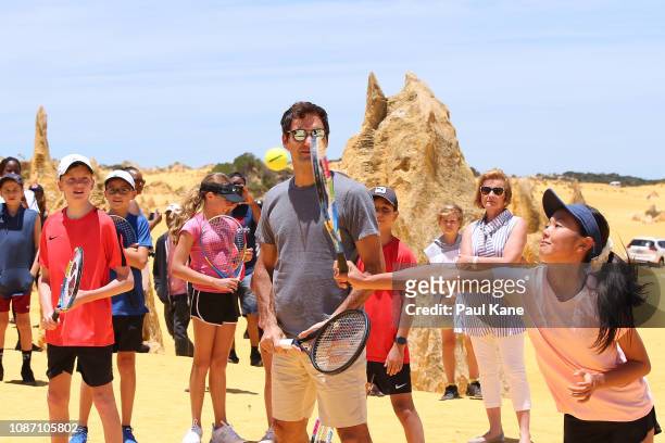 Roger Federer interacts with junior tennis players at the Pinnacles Desert ahead of the 2019 Hopman Cup on December 27, 2018 in Cervantes, Australia.