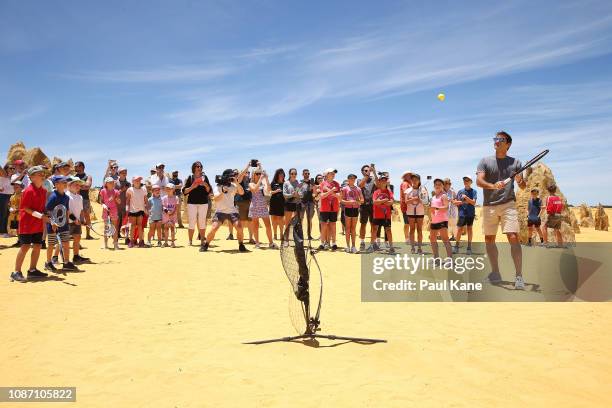 Roger Federer interacts with junior tennis players at the Pinnacles Desert ahead of the 2019 Hopman Cup on December 27, 2018 in Cervantes, Australia.