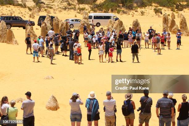 Roger Federer interacts with junior tennis players at the Pinnacles Desert ahead of the 2019 Hopman Cup on December 27, 2018 in Cervantes, Australia.