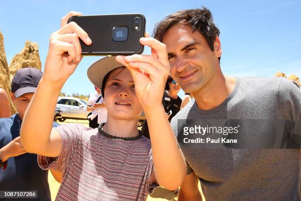 Roger Federer poses for a selfie with a young boy at the Pinnacles Desert ahead of the 2019 Hopman Cup on December 27, 2018 in Cervantes, Australia.