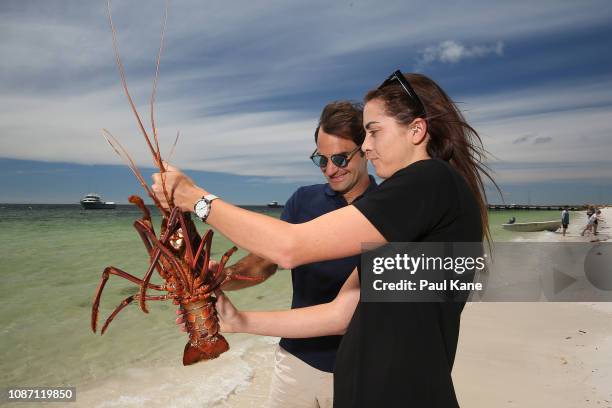 Roger Federer holds a Western Rock Lobster on the beach at The Lobster Shack ahead of the 2019 Hopman Cup on December 27, 2018 in Cervantes,...