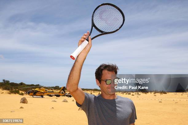 Roger Federer waves farewell well wishers at the Pinnacles Desert ahead of the 2019 Hopman Cup on December 27, 2018 in Cervantes, Australia.