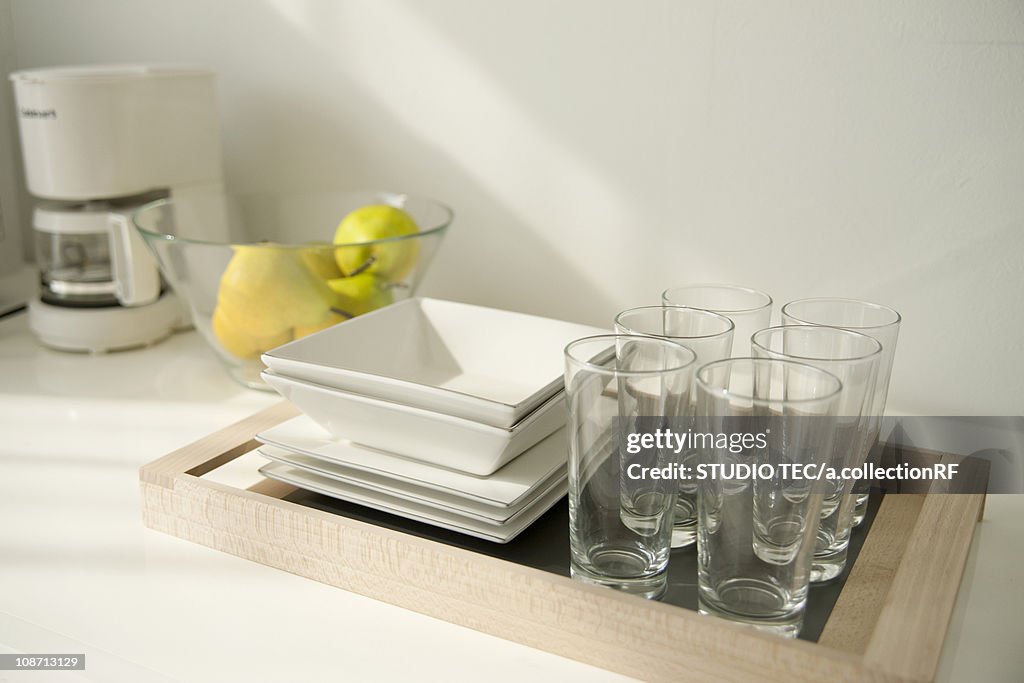 Glasses and plates on tray