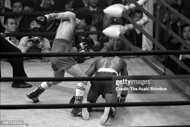 Champion Yoko Gushiken of Japan knocks out Alfonso Lopez of Panama in the 7th round during the WBA Junior Flyweight Title Bout at Kuramae Kokugikan...