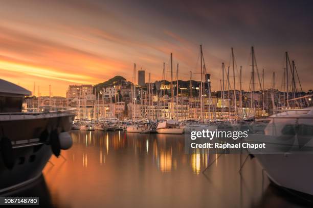 photograph of cannes and it marina during sunset.  french riviera, france - canne stock pictures, royalty-free photos & images