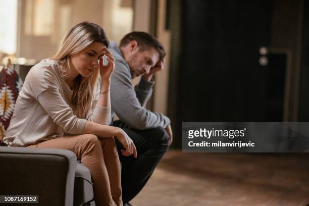 unhappy young couple - married stock pictures, royalty-free photos & images