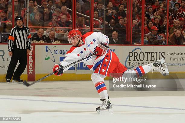 Mike Green of the Washington Capitals takes a shot during a NHL hockey game against the Montreal Canadiens on February 1, 2011 at the Verizon Center...