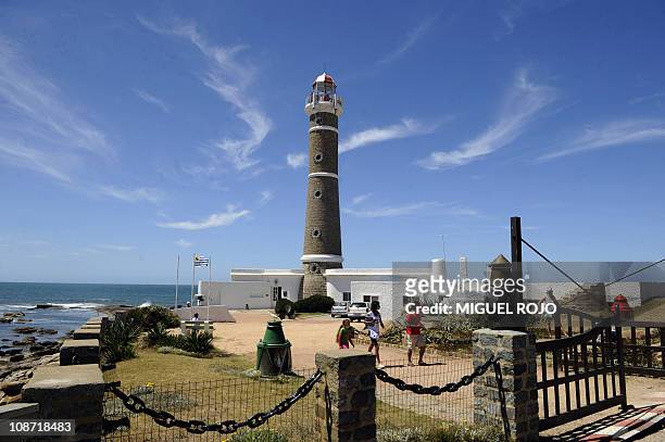 Tourists enjoy the lighthouse in Jose Ignacio, Maldonado, 180km east of Montevideo on January 18, 2011. AFP PHOTO/Miguel ROJO