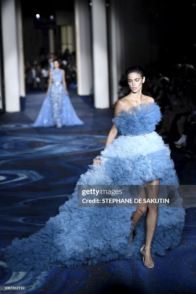 A model presents a creation by Zuhair Murad during the 2019... News ...