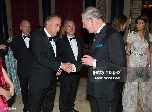 Prince Charles, Prince of Wales, President of The Prince's Foundation for Children and the Arts talks with guests at a charity gala dinner and...