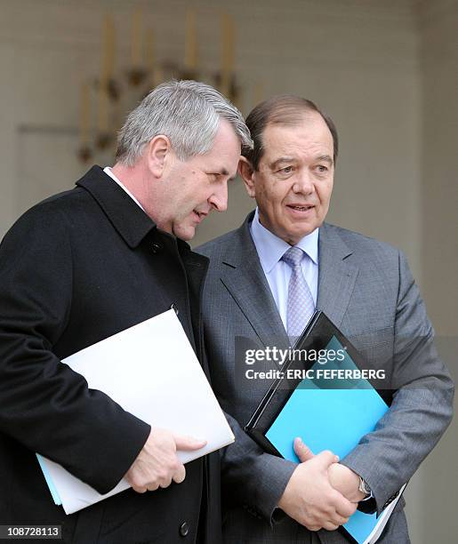 France's Parliamentary Relations Minister Patrick Ollier and France's Local Government Minister Philippe Richert leave the Elysee Palace after the...