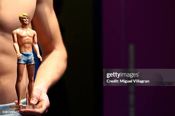 Models dressed the same way as different Ken dolls pose during the press preview day of the International Toy Fair Nuernberg on February 2, 2011 in...