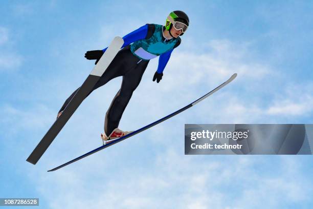 vorderansicht des männlichen skispringer in der luft gegen den blauen himmel - ski jumping stock-fotos und bilder