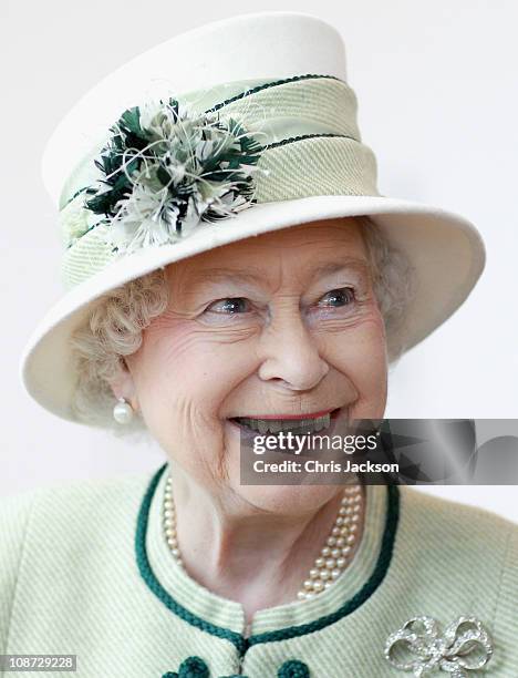 Queen Elizabeth II smiles as she visits Palm Paper on February 2, 2011 in Norwich, England. The Queen and Duke of Edinburgh are visiting sites today,...