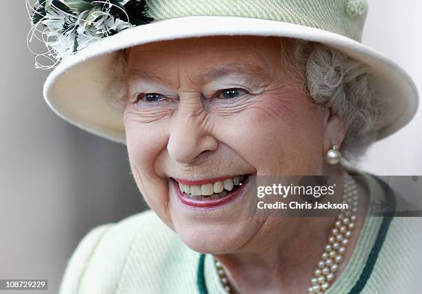 Queen Elizabeth II smiles as she visits Palm Paper on February 2, 2011 in Norwich, England. The Queen and Duke of Edinburgh are visiting sites today,...