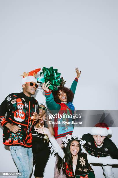 generation z friends christmas photo booth - ugly christmas sweater party stock pictures, royalty-free photos & images