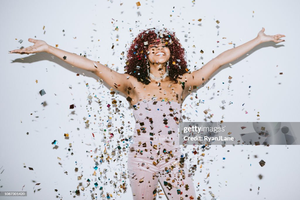 Generation Z Young Woman Celebrates With Confetti