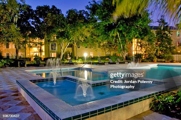 condo by the fountain pool evening - fountain stock pictures, royalty-free photos & images