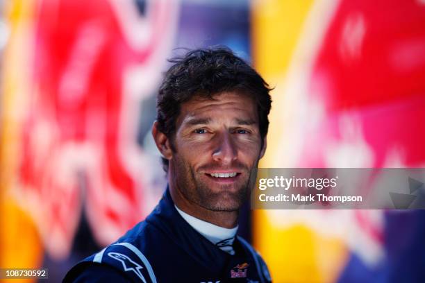 Mark Webber of Australia and Red Bull Racing poses for a photograph behind his team garage during day two of winter testing at the Ricardo Tormo...