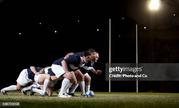 rugby players in scrum on pitch - rugby union fotografías e imágenes de stock