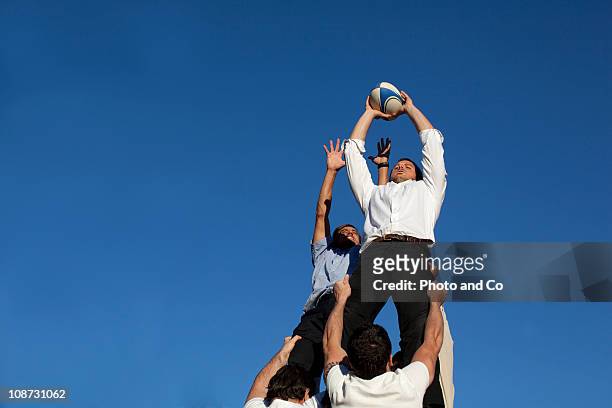 businessmen playing rugby, rugby union lineout - rugby sport foto e immagini stock