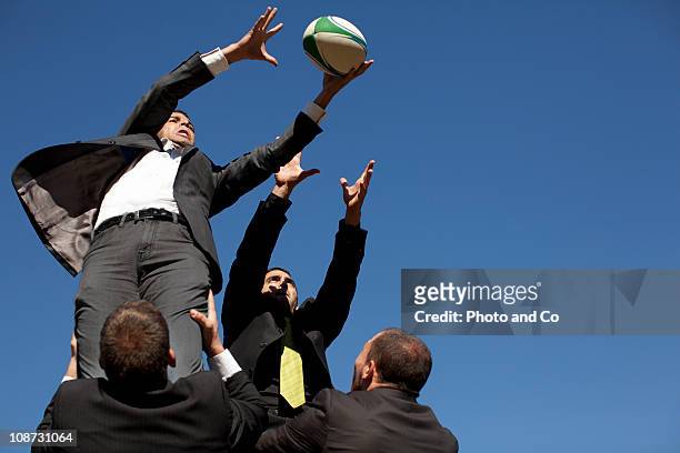 businessmen playing rugby, rugby union lineout - rugby line out stock pictures, royalty-free photos & images