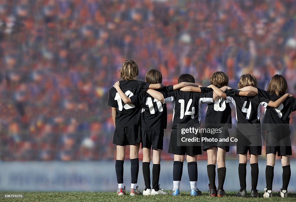 Six boys players (10-11) standing in