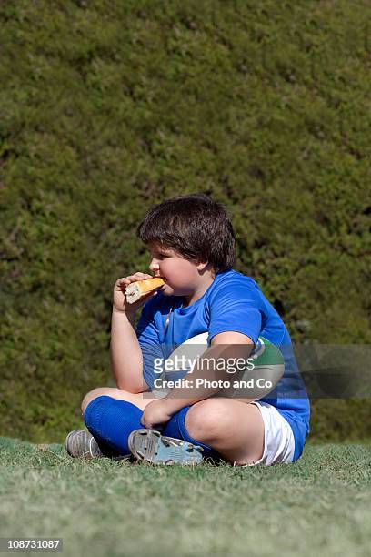 boy rugby eating sandwich - kids rugby stock pictures, royalty-free photos & images