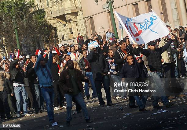 Supporters of embattled Egyptian president Hosni Mubarak advance during a clash between pro- and anti-Mubarak protesters February 2, 2011 in Tahrir...