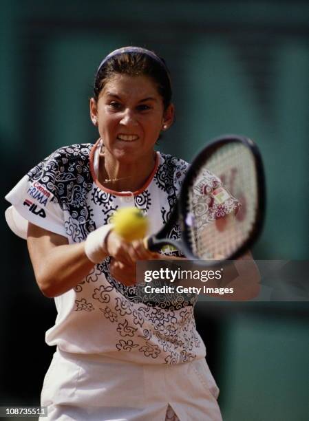 Monica Seles makes a double hand return against Steffi Graf during the Women's Singles final match during the French Open Tennis Championship on 6th...