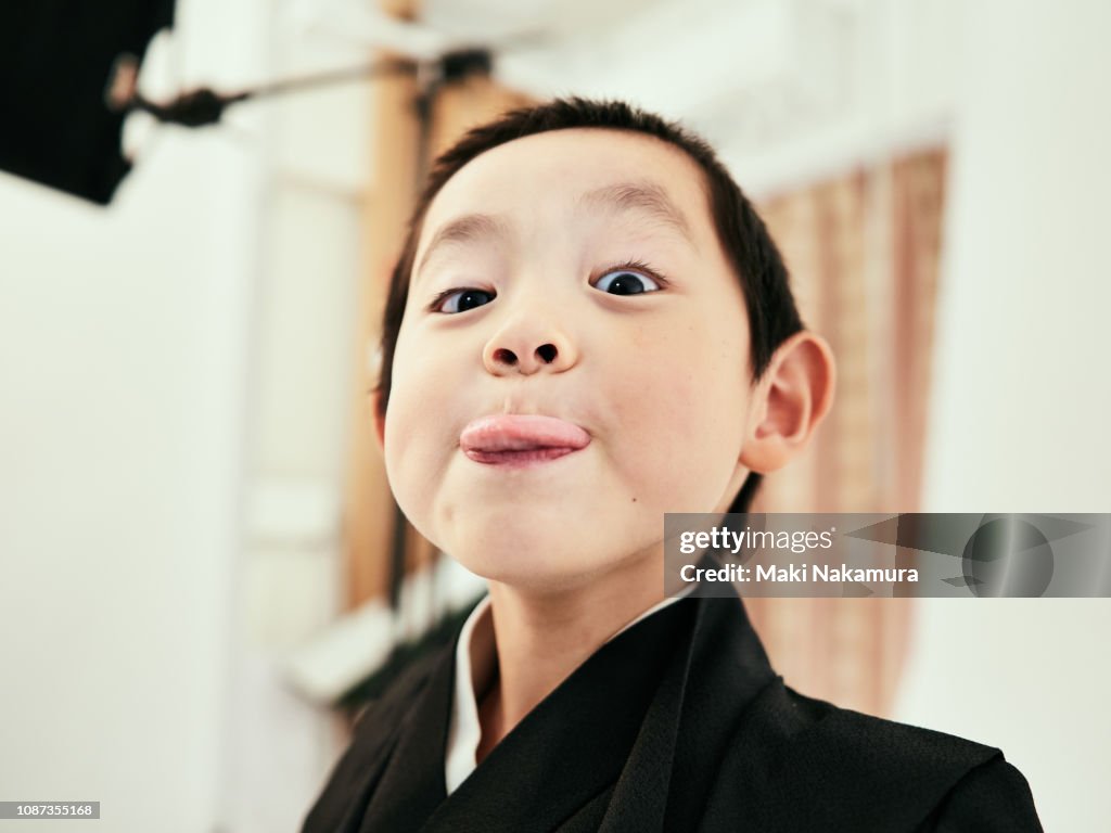 A boy with a challenging look towards the camera