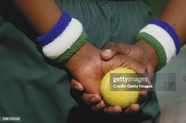 Ballboy with his Wimbledon sweatbands holds a tennis in preparation during the Wimbledon Lawn Tennis Championships on 1st July 1987 at the All...