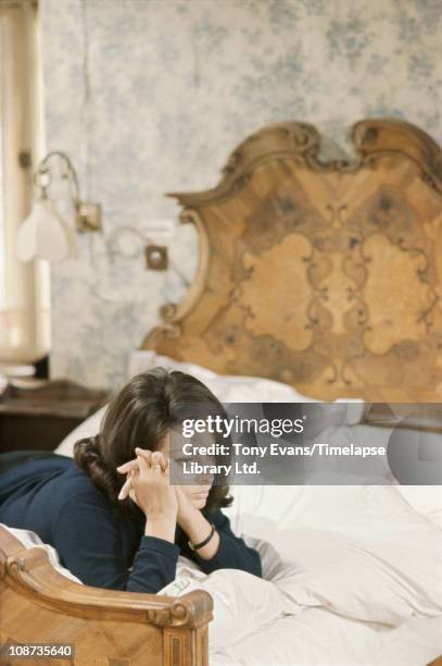 Italian actress Sophia Loren lying on a bed on the set of 'Operation Crossbow', produced by Carlo Ponti, 1965.