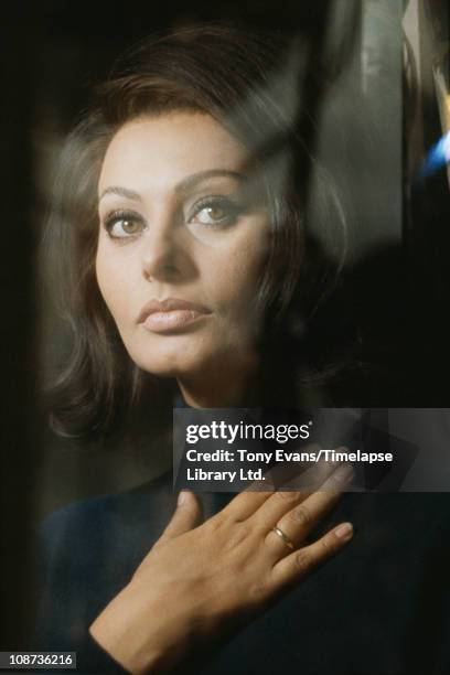 Italian actress Sophia Loren with her hand on her chest on the set of 'Operation Crossbow', produced by Carlo Ponti, 1965.
