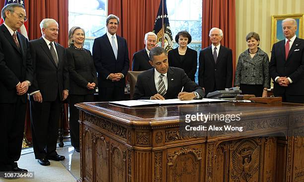 President Barack Obama signs the New START Treaty into law as Secretary of Energy Steven Chu, Secretary of Defense Robert Gates, Secretary of State...
