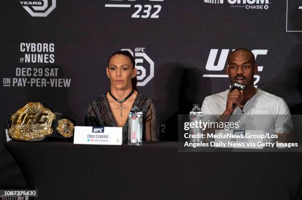 Cris Cyborg, UFC women"u2019s featherweight champion, left, and Jon Jones, No. 1 UFC light heavyweight, during UFC 232 press conference at the Los...