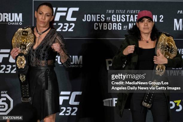 Cris Cyborg, UFC women's featherweight champion, left, and Amanda Nunes, UFC women's bantamweight champion, during UFC 232 press conference at the...