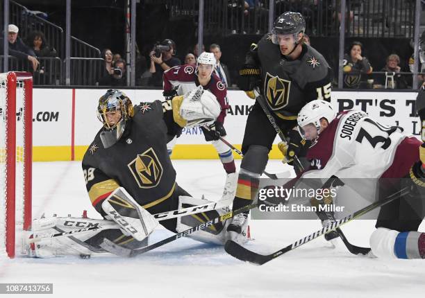 Marc-Andre Fleury of the Vegas Golden Knights blocks a shot by Carl Soderberg of the Colorado Avalanche as Jon Merrill of the Golden Knights defends...
