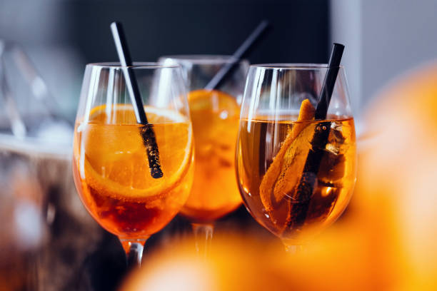 aperitif spritz drinks - orange cocktail stock pictures, royalty-free photos & images