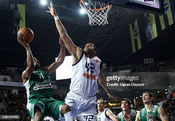 DeJuan Collins, #41 of Zalgiris Kaunas in action against Sean Gregory May, #42 of Fenerbahce Ulker Istanbul during the 2010-2011 Turkish Airlines...